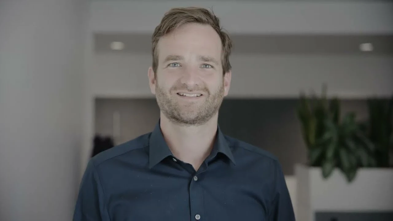 Thumbnail for FCC Environment CEE Group video "Join Us and Make a Difference", featuring a smiling man in a navy shirt standing in an office lobby.
