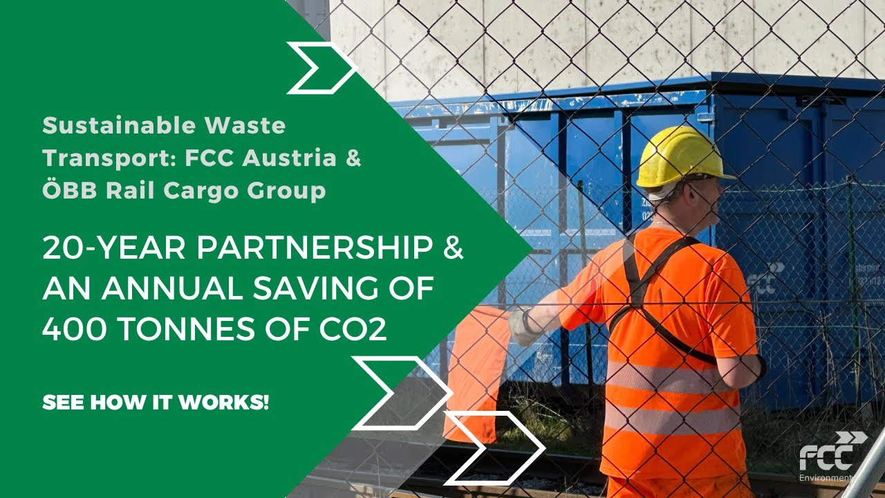 Thumbnail for FCC Environment video "Sustainable Waste Transport: FCC Austria & ÖBB Rail Cargo Group – 20-Year Partnership & an Annual Saving of 400 Tonnes of CO2", featuring an FCC worker in high-visibility gear near a blue cargo container, viewed through a chain-link fence.